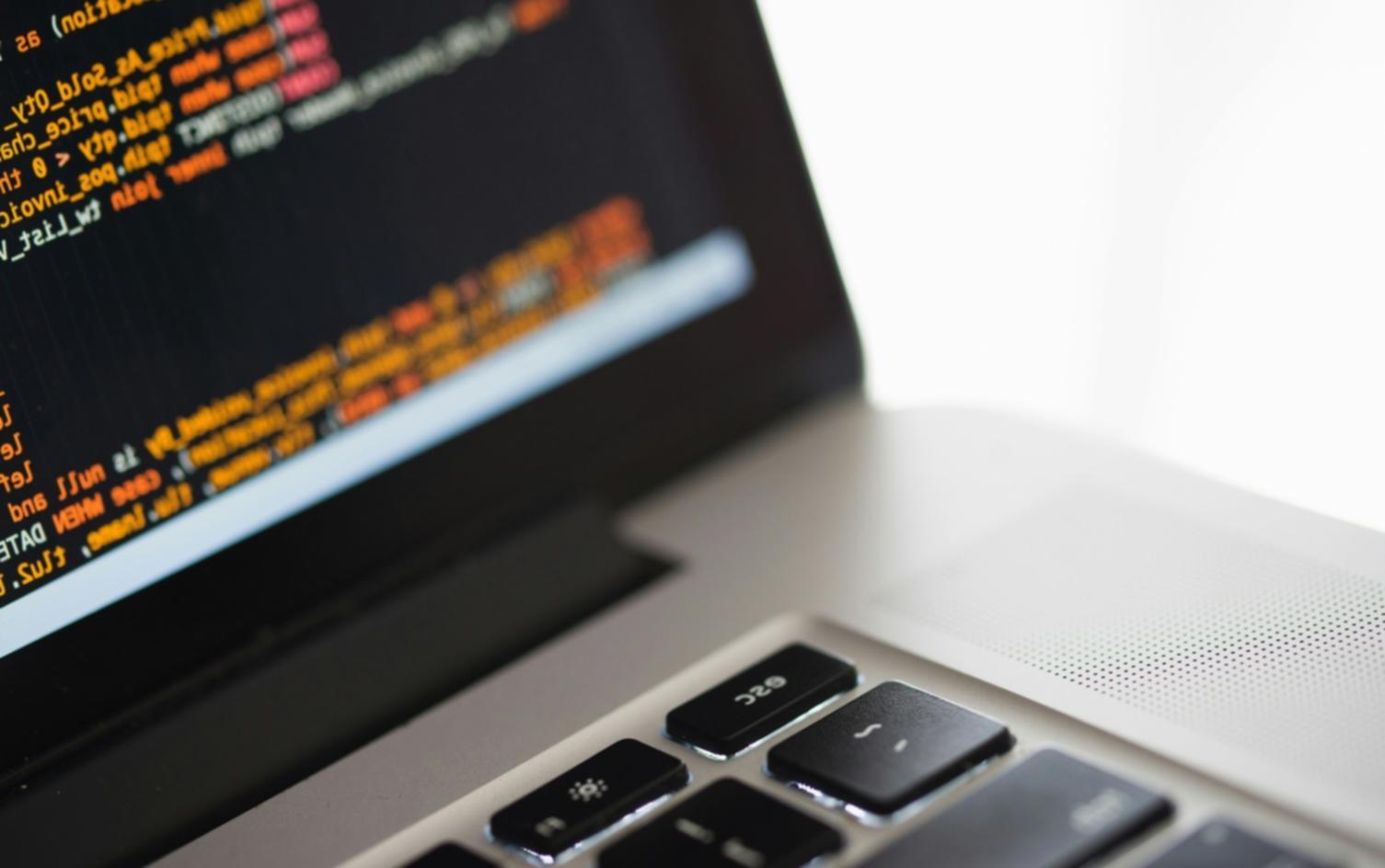 Students working on database fundamentals in computer lab